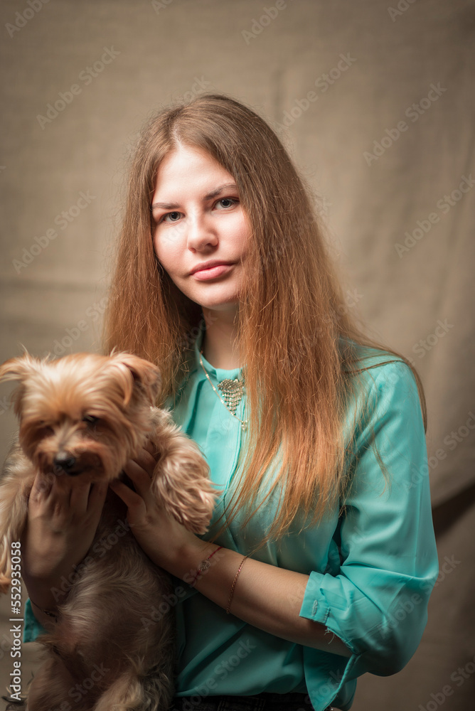 Studio portrait of a young beautiful long-haired girl. Studio portrait of a young beautiful long-haired girl.