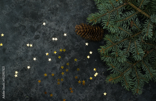 Christmas background with gold stars and fir branches