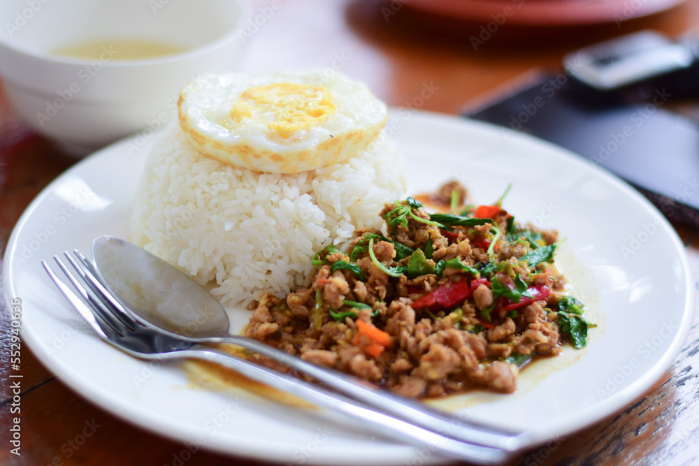 close up thai food, minced pork stir-fry with fried egg close up thai food, minced pork stir-fry with fried egg