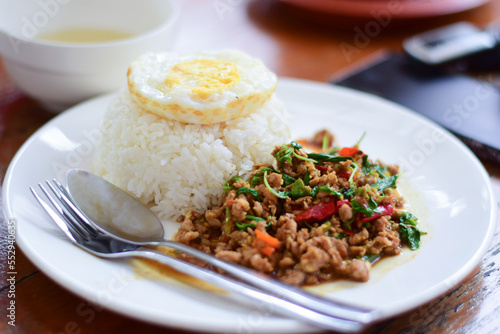close up thai food, minced pork stir-fry with fried egg