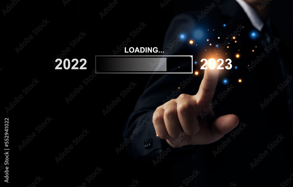 Businessman pointing to 2023, loading bar for count down from 2022 to 2023 year, Start up business and success. Businessman pointing to 2023, loading bar for count down from 2022 to 2023 year, Start up business and success.