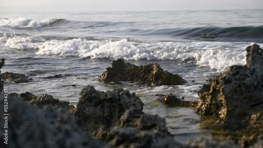 Close up waves on Seashore in a beautiful sunset reflected on the sea. Slow motion 4K Close up waves on Seashore in a beautiful sunset reflected on the sea. Slow motion 4K