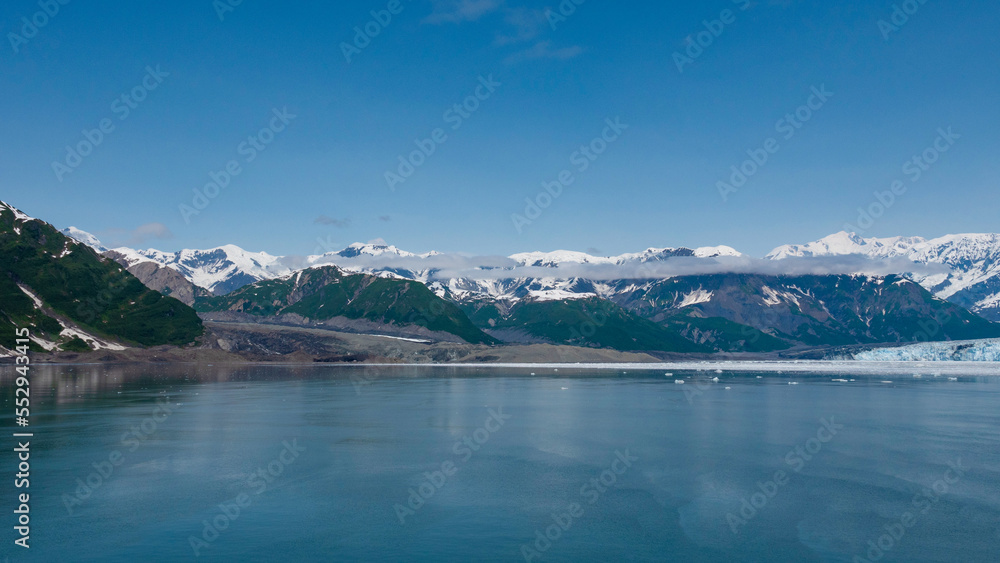 Mountain glacier under blue sky nature. Hubbard Glacier nature in Alaska, USA. Glacier bay nature