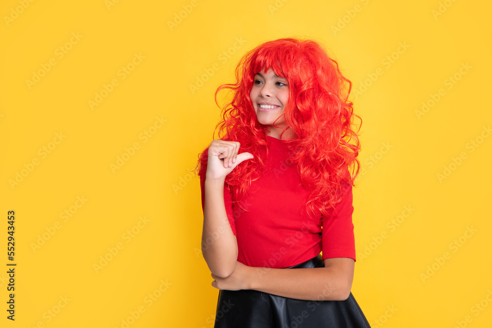 cheerful teen kid with red long hair on yellow background cheerful teen kid with red long hair on yellow background