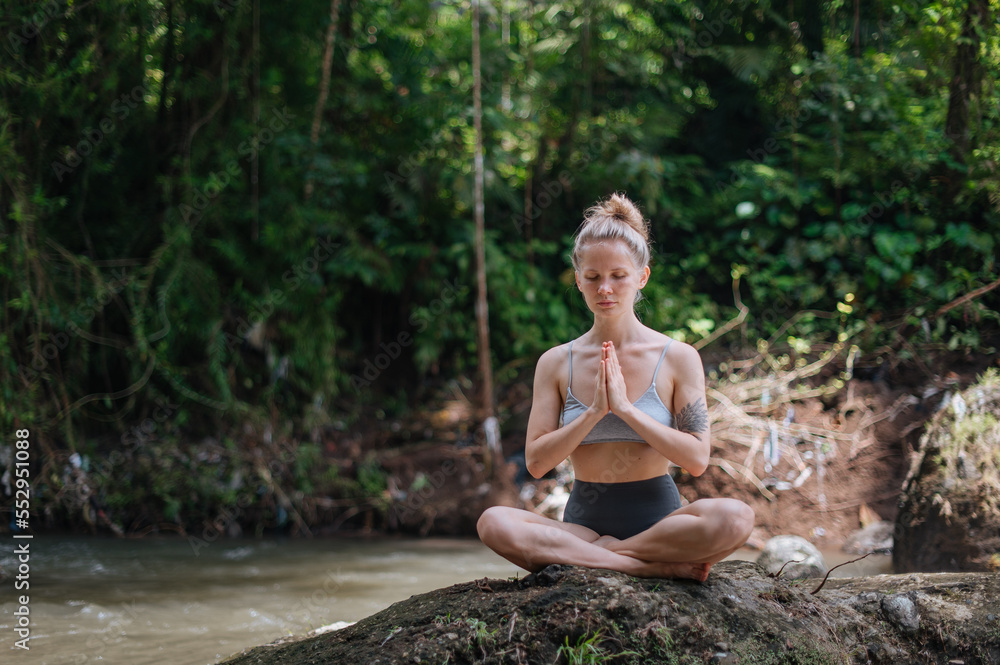 Girl practice yoga meditation outdoor in park Girl practice yoga meditation outdoor in park