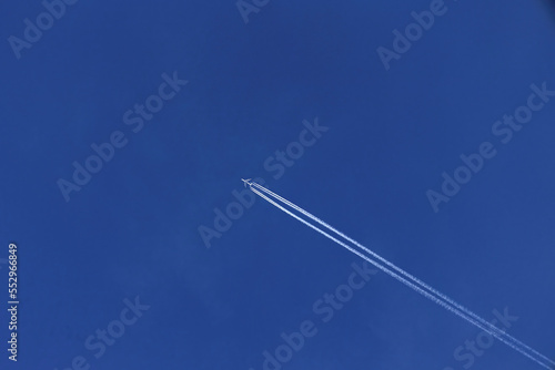 Airplane contrails in Blue Sky for use as a background 