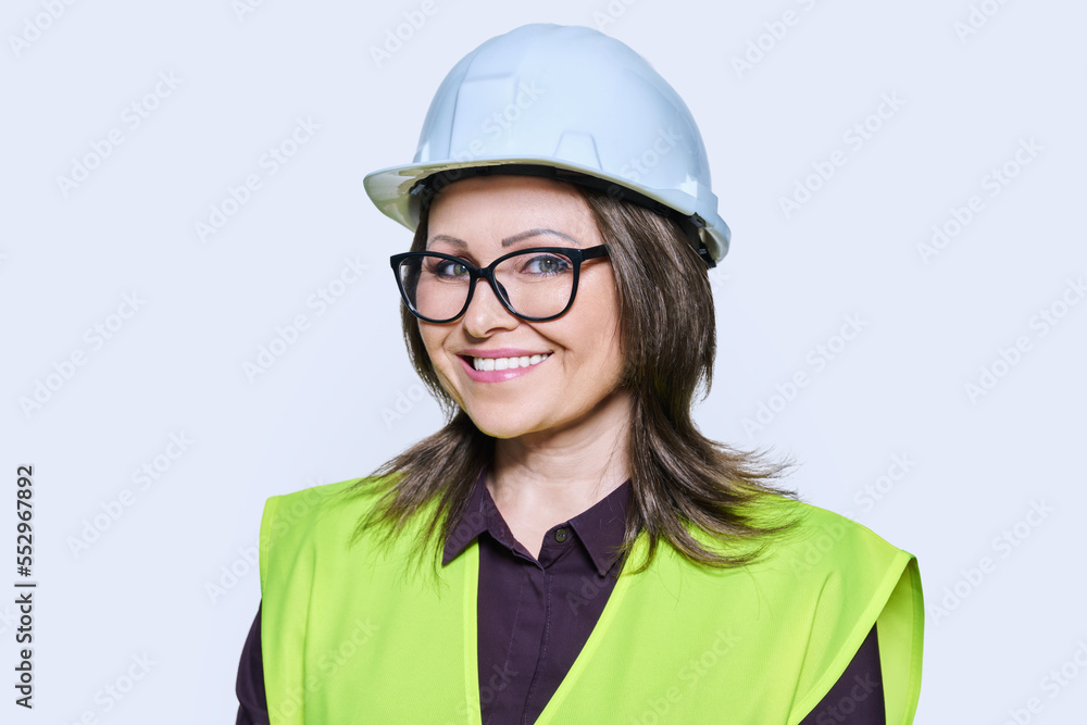 Female industrial construction worker in hardhat vest on white background Female industrial construction worker in hardhat vest on white background