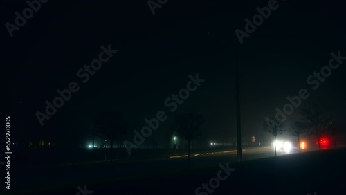 Total darkness in the cities of Ukraine. Car headlights the only source of light outdoors. Blackout resulting from power stations bombing. photo