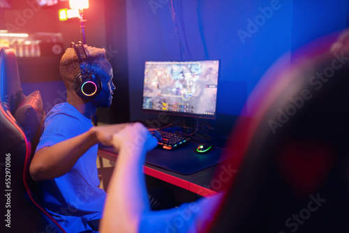 Canvas Print Two man professional cyber sport gamers giving fist hand bump
