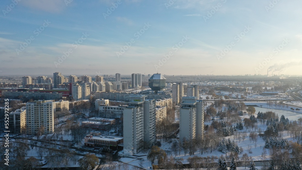 Vostok microdistrict in Minsk in winter. Sleeping areas of the capital of Belarus in the snow. Snow-covered Minsk in winter. Aerial photography of Minsk from above. Eastern Europe.