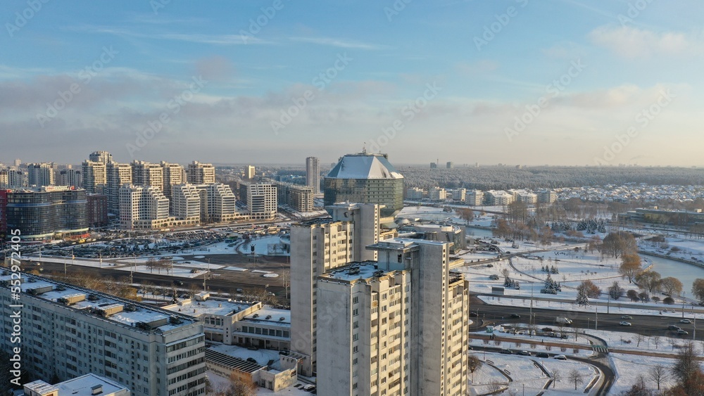 Obraz premium Vostok microdistrict in Minsk in winter. Sleeping areas of the capital of Belarus in the snow. Snow-covered Minsk in winter. Aerial photography of Minsk from above. Eastern Europe.