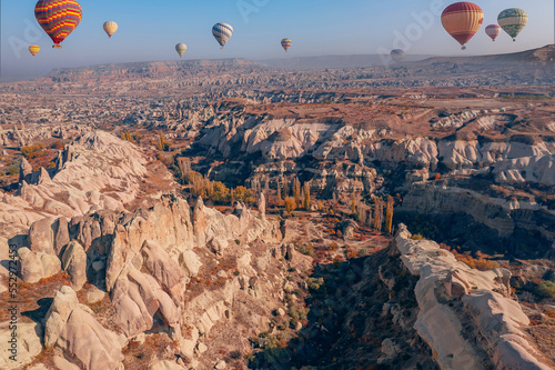 Panoramic view of Goreme national park with over deep canyons, valleys sunset Cappadocia. Popular Turkey touristic destination for summer holidays