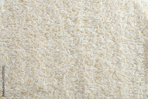 Top view of dry uncooked instant long grain rice as a background. Flat lay.