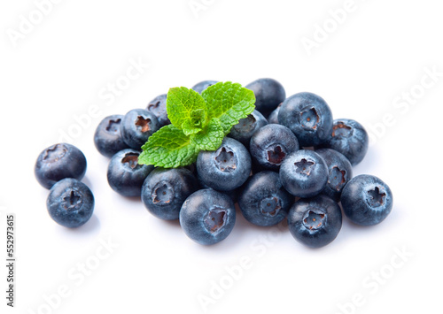 Sweet blueberries with mint on white backgrounds.
