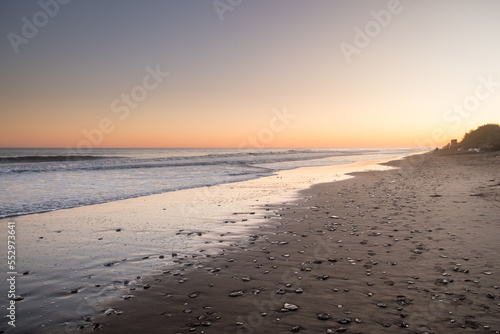 Fototapeta Naklejka Na Ścianę i Meble -  Sunset at beach with pebbles, Pehuen-Có, Argentina