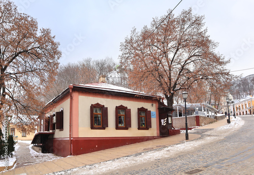 Old houses at Andriyivsky descent in winter in Kyiv, Ukraine photo