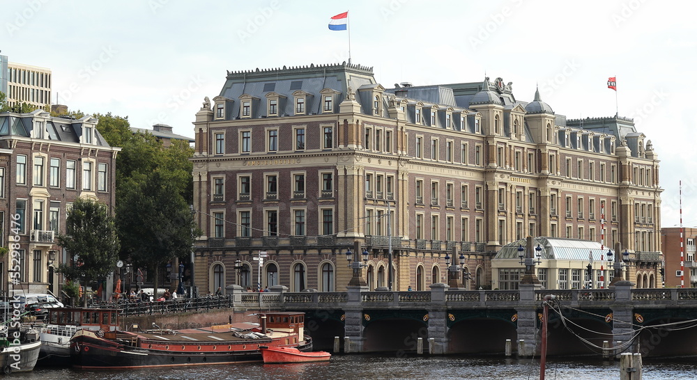 Amsterdam Amstel River View with Buildings and Bridge, Netherlands