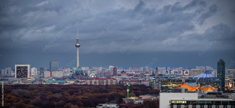 Panorama of the illuminated skyline of Berlin, Germany, from Potsdamer Platz down to Alexanderplatz during a cloudy winter day
