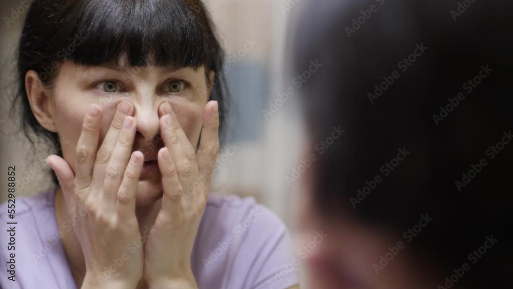 Woman Confused About Facial Wrinkles Aging Skin on Forehead Looking at Mirror. Wrinkles on Eyes on Face Skin. Woman Having Problem With Eyes Bags Dark Circles Wrinkles. Stress Depression Fatigue Diet. Woman Confused About Facial Wrinkles Aging Skin on Forehead Looking at Mirror. Wrinkles on Eyes on Face Skin. Woman Having Problem With Eyes Bags Dark Circles Wrinkles. Stress Depression Fatigue Diet.