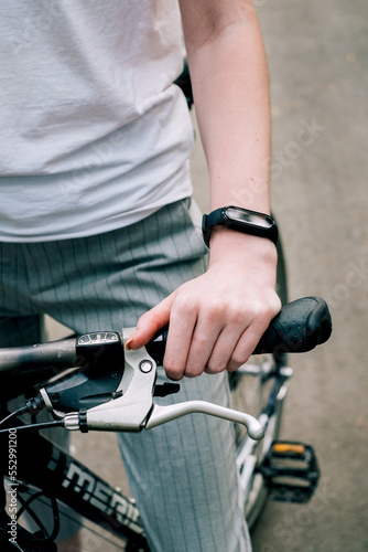 female hands with cycle on road, navigation search sports woman monochrome, biker woman holding bike on health lifestyle road 