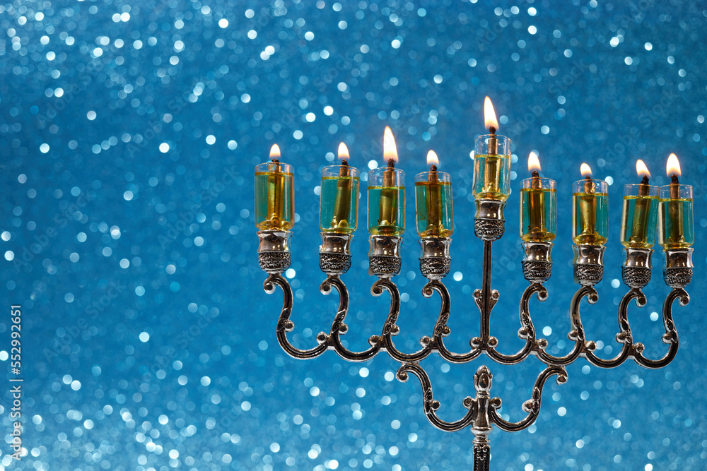 Jewish holiday Hanukkah background with menorah -traditional candelabra and candles Jewish holiday Hanukkah background with menorah -traditional candelabra and candles