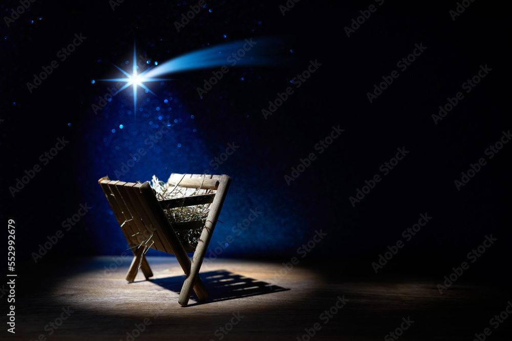 Nativity of Jesus, empty manger at night with bright lights. - obrazy, fototapety, plakaty 