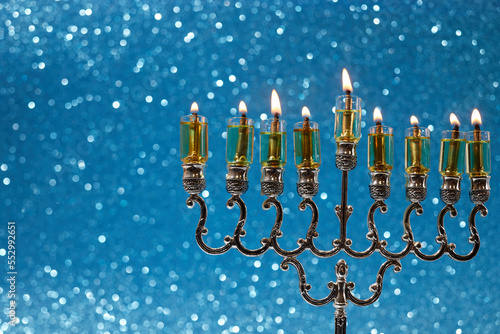 Jewish holiday Hanukkah background with menorah -traditional candelabra and candles