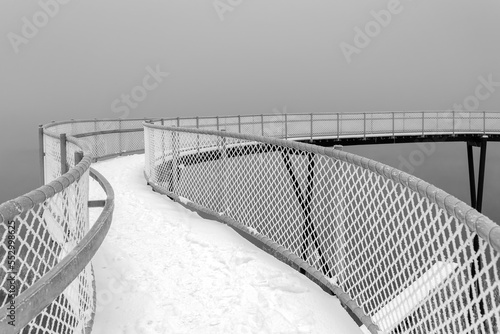 Zarasai Lake observation bridge and the coast of Zarasai Lake in winter and big fog photo