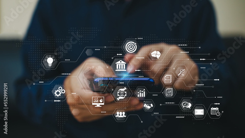 Businessman using smartphone on global business network connection for online banking transaction and payment, digital marketing. Financial technology and big data on internet concept.