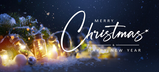 Art Merry Christmas and Happy Holidays greeting card, frame, banner. New Year. Noel. Christmas light ornaments on blue snowy background. Winter xmas holiday theme.