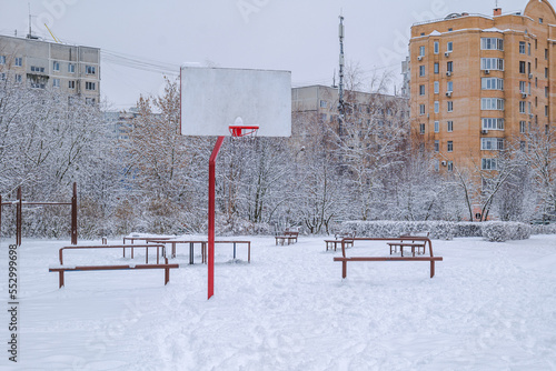 Basketball court on the territory of a comprehensive school in winter. Balashikha, Russia