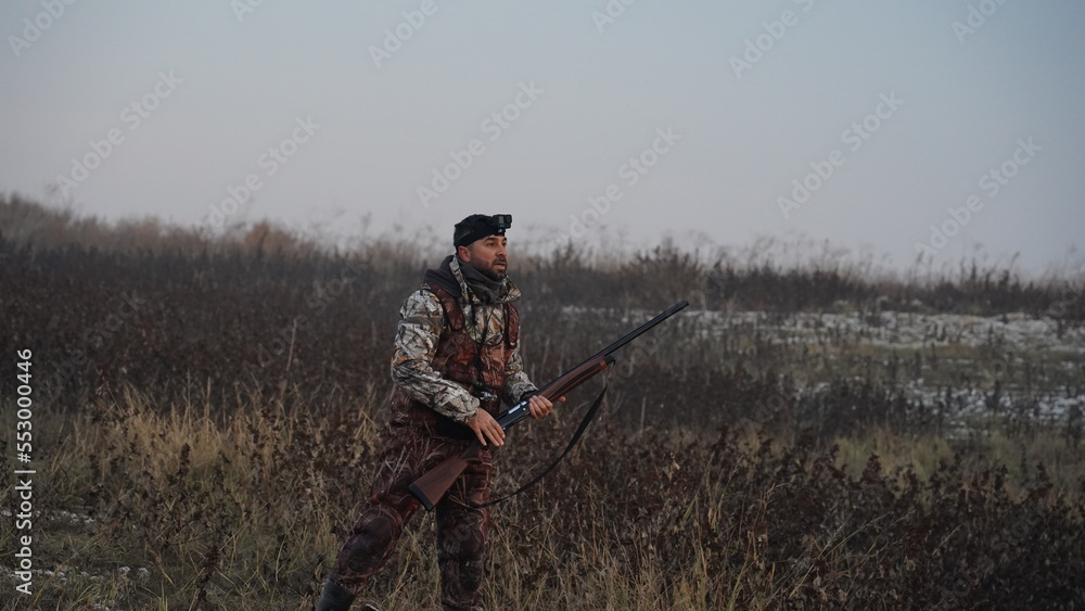 hunting by the creek in the forest. And hunting birds. Hunter hunting at sunrise hunting by the creek in the forest. And hunting birds. Hunter hunting at sunrise