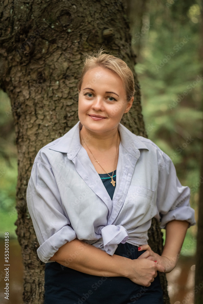 Portrait of a beautiful young fair-haired girl in the forest. Portrait of a beautiful young fair-haired girl in the forest.