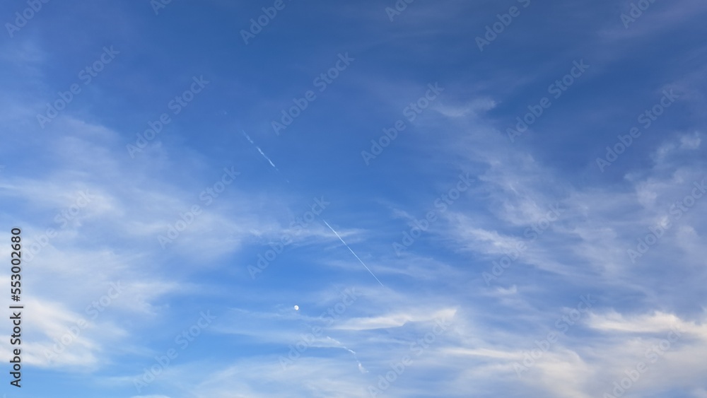 Blue sky and white streaks of clouds. Background. Texture. Copy space Blue sky and white streaks of clouds. Background. Texture. Copy space