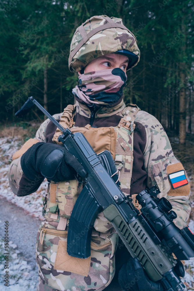 Russian soldier patrols the forest