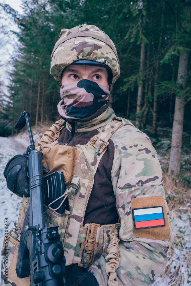 Russian soldier in occupied territory. Soldier patrols with an assault rifle. 