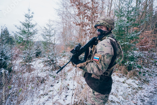 Russian soldier in occupied territory. Soldier patrols with an assault rifle.  photo