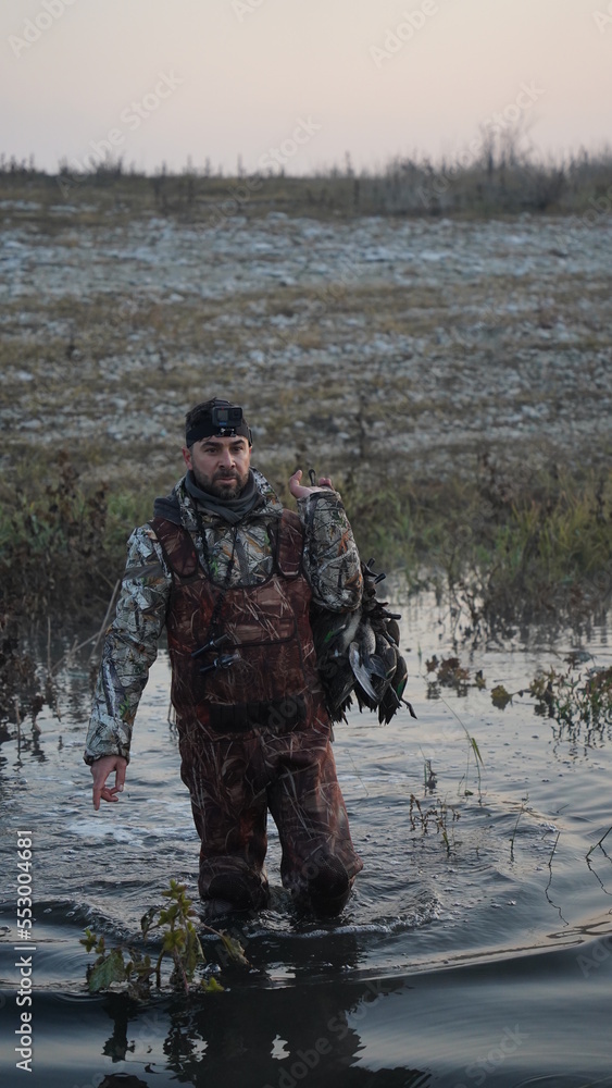 Fototapeta premium hunting by the creek in the forest. And hunting birds. Hunter hunting at sunrise
