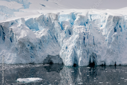 Antarctic Glacier reflecting in clear water at Neko Harbor Antarctica