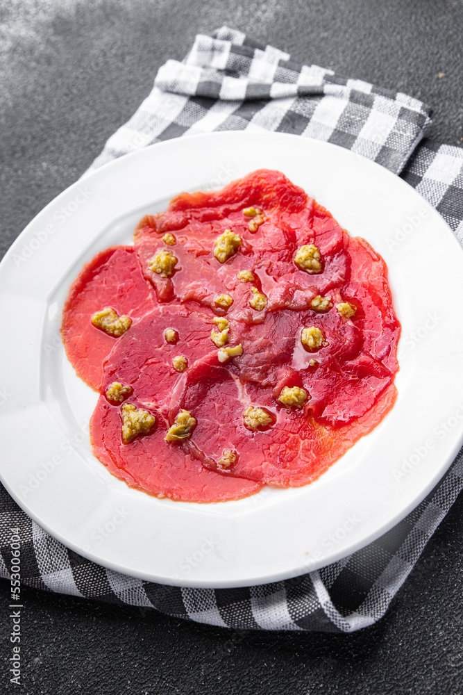 carpaccio antipasti appetizer raw meat beef thin slices fresh healthy meal food snack on the table copy space food background rustic top view carpaccio antipasti appetizer raw meat beef thin slices fresh healthy meal food snack on the table copy space food background rustic top view