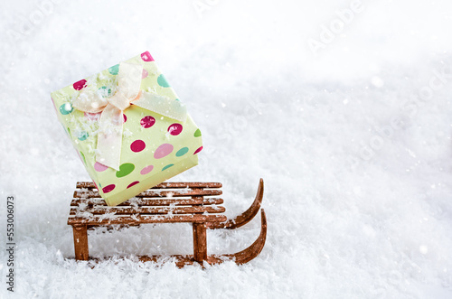 box of gifts on a sled in the snow