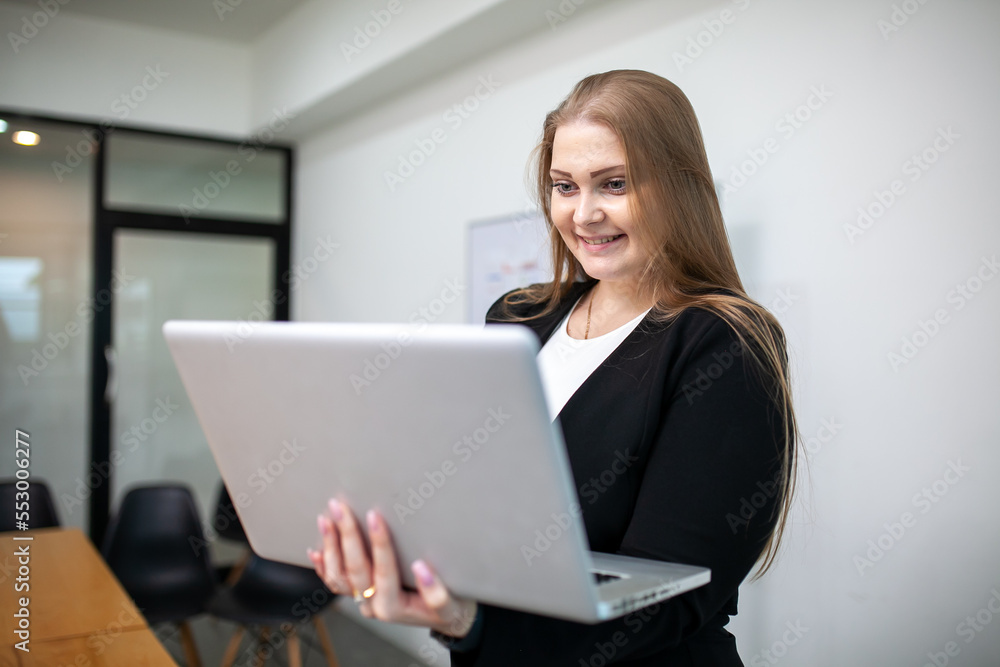 Portrait of beautiful business woman working at the office, using computer. buiness concept. Portrait of beautiful business woman working at the office, using computer. buiness concept.