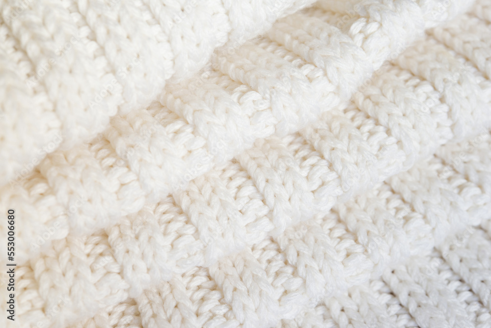White knitted texture of woolen wool White knitted texture of woolen wool