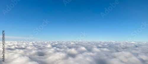Canvas Print Aerial view of sea of white clouds in the blue sky
