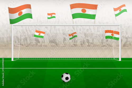Niger football team fans with flags of Niger cheering on stadium, penalty kick concept in a soccer match.