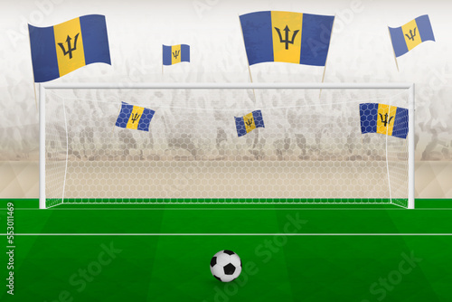 Barbados football team fans with flags of Barbados cheering on stadium, penalty kick concept in a soccer match.