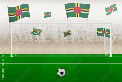 Dominica football team fans with flags of Dominica cheering on stadium, penalty kick concept in a soccer match.