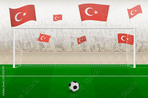 Turkey football team fans with flags of Turkey cheering on stadium, penalty kick concept in a soccer match.