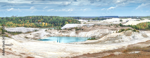 Amazing kaoline quarry, texture of kaolin quarry, beautiful lake, view of industrial clay hills, environment after mining photo