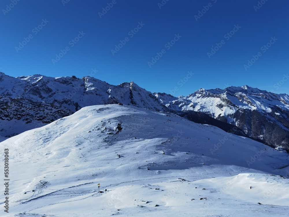 winter walking in the alps, the hohe tauern national park in austria, at a cold and sunny day